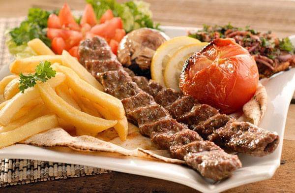 Mixed grill platter with fries and salad at Gate of Yemen Restaurant