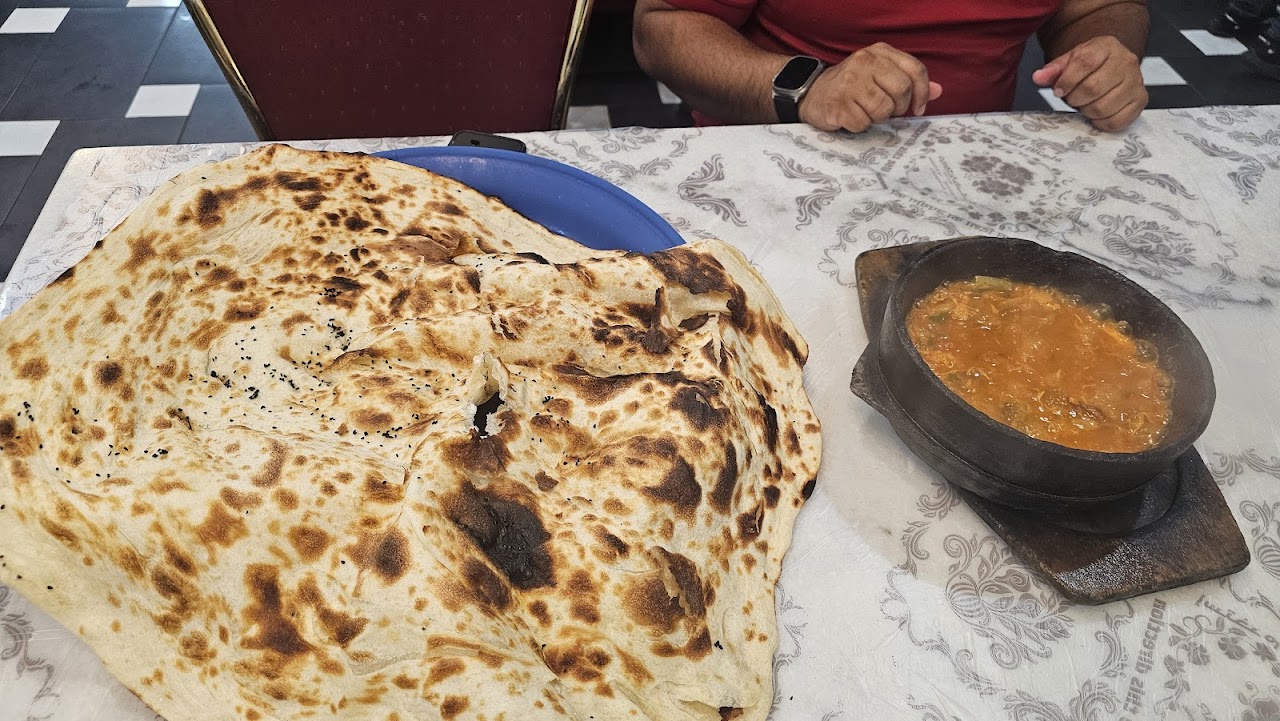 Taboon bread and stew at Gate of Yemen Restaurant