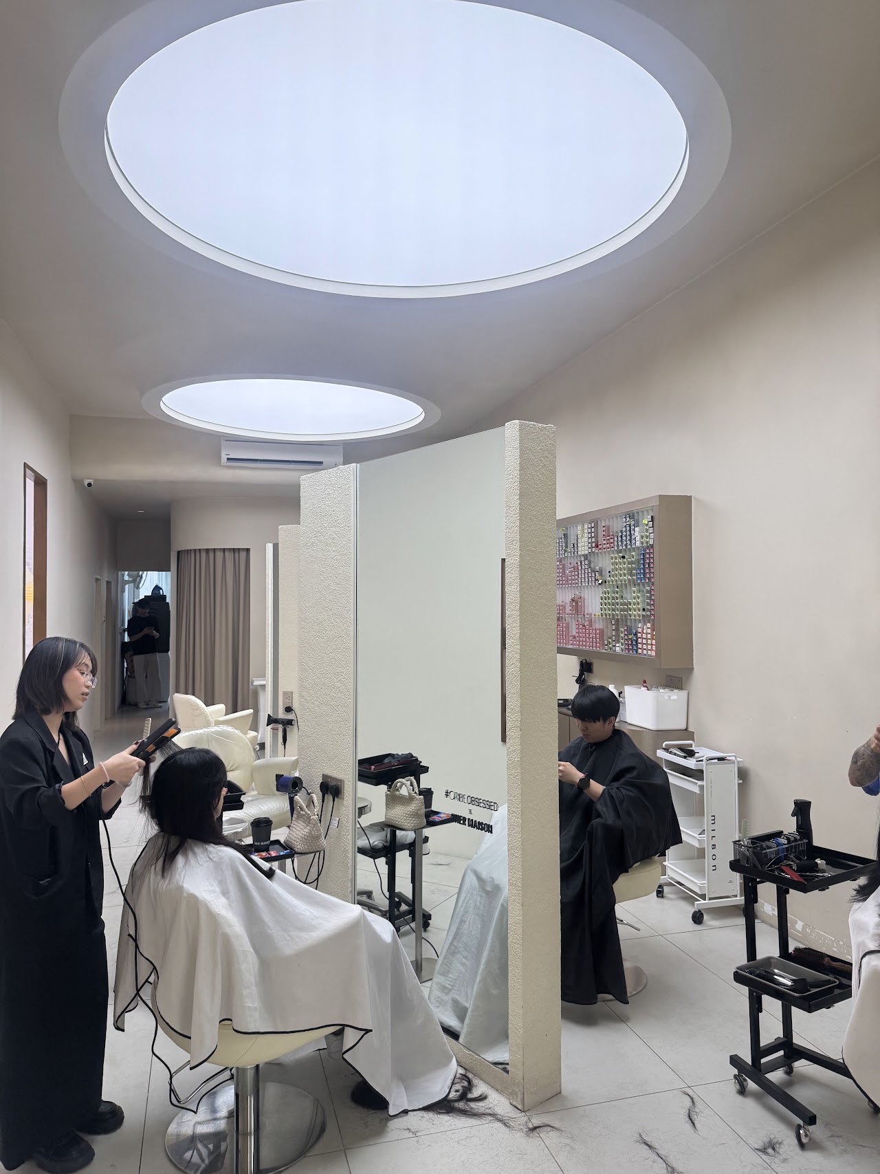 Her Maison styling floor under recessed oval skylights