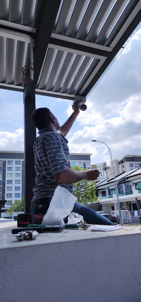 Heroshe Joy Electrical technician installing a CCTV camera, Petaling Jaya