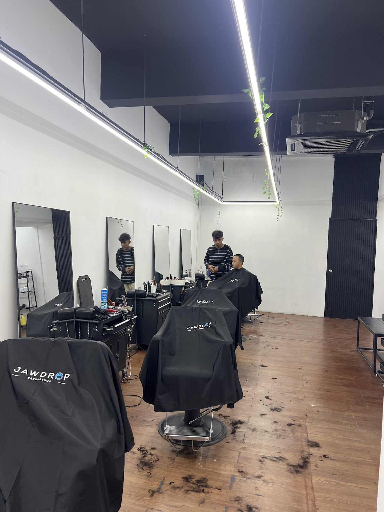 Jawdrop Barbershop interior, barber chairs and styling stations