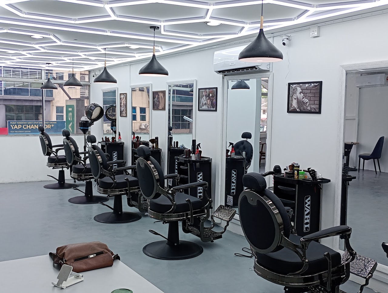 MD Hilmi Barber Shop interior, row of vintage barber chairs under a hexagonal LED ceiling
