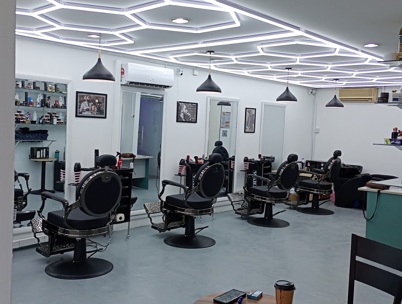 MD Hilmi Barber Shop interior, hexagonal LED ceiling over styling stations