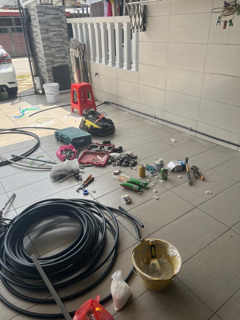 Tools and materials laid out on-site by Mohd Adil Plumber