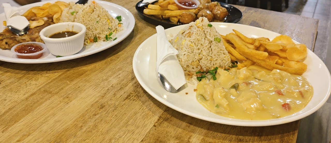 Fried rice with chicken chop and fries plate at Murni Discovery