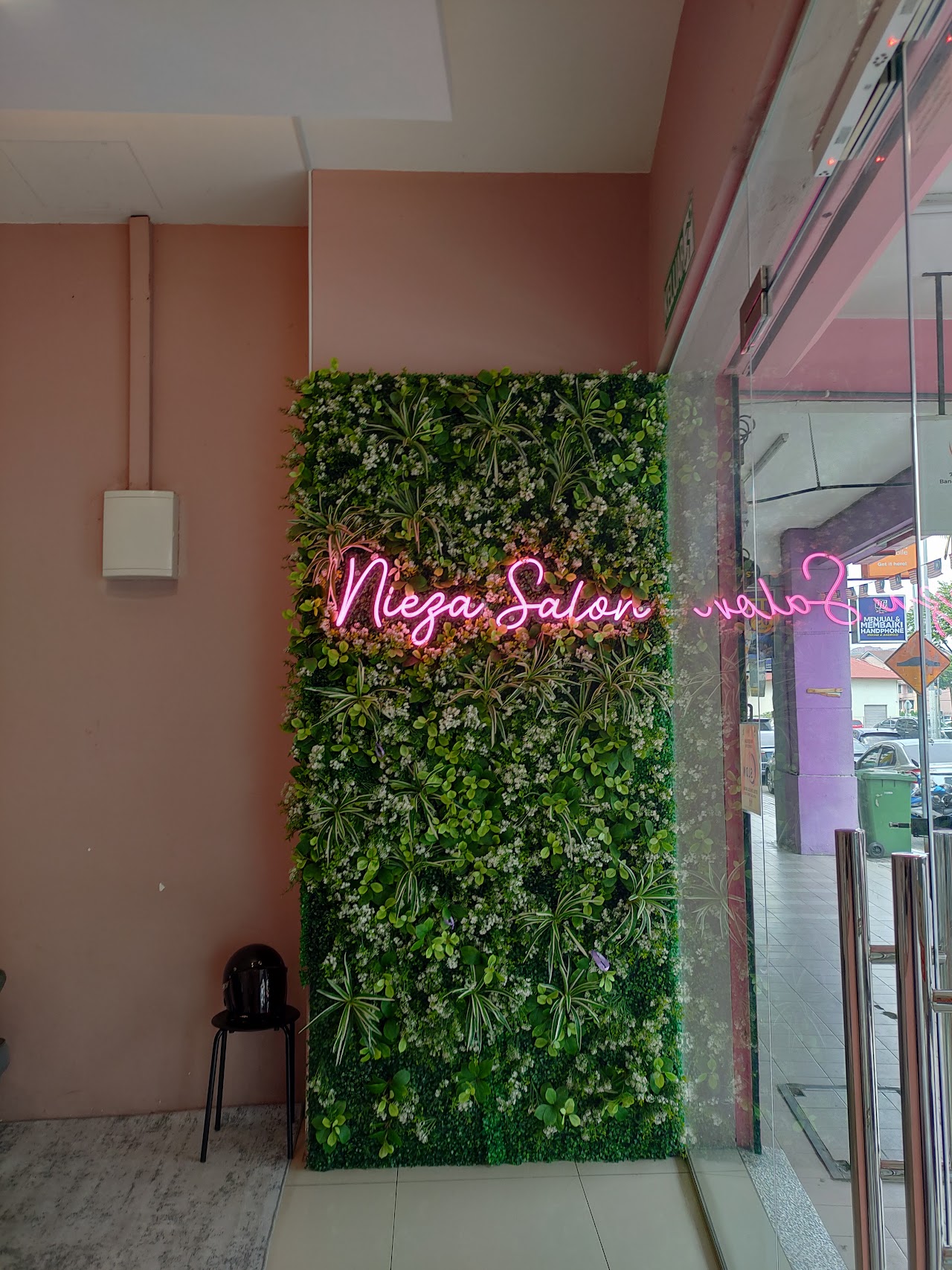 Nieza Salon storefront, neon sign on a living green wall, Bandar Sri Permaisuri