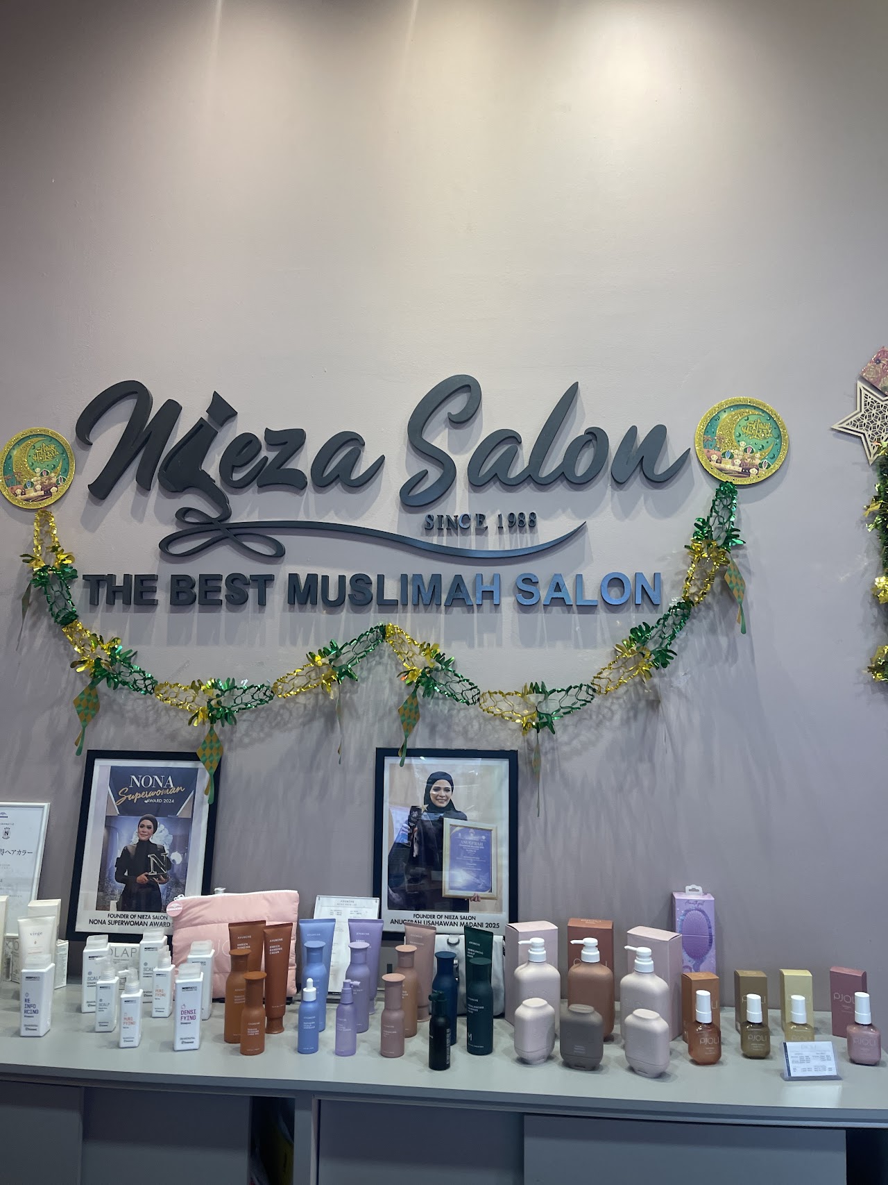 Nieza Salon heritage wall — since 1988, the best Muslimah salon, with award seals