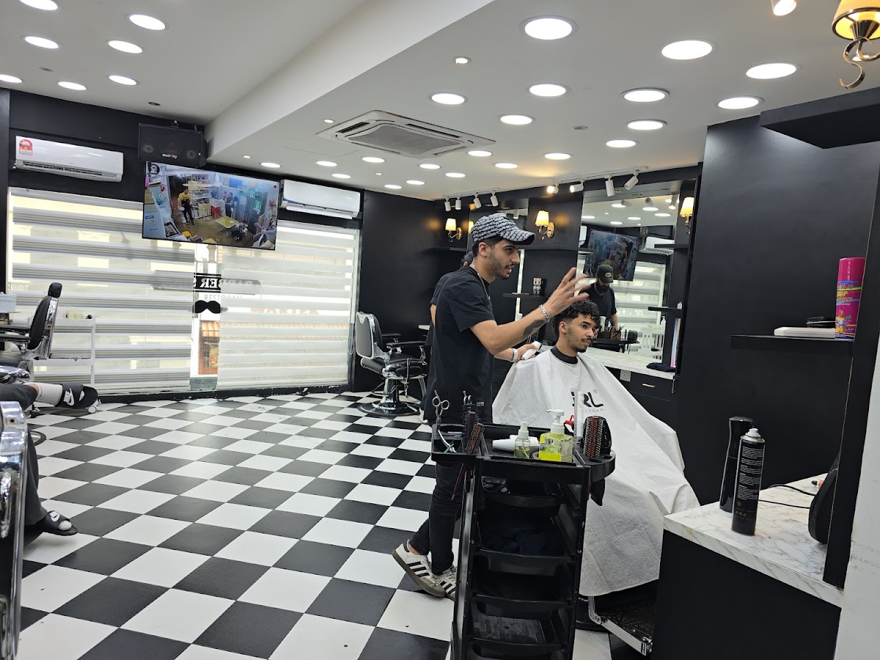 Old7 Barber Shop interior, checkerboard floor