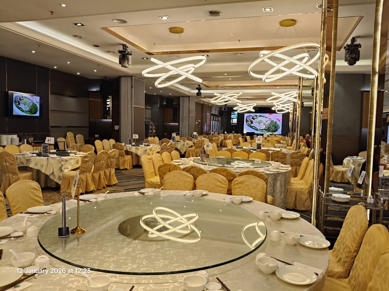 OUG Jade Restaurant banquet hall, gold chairs and chandeliers