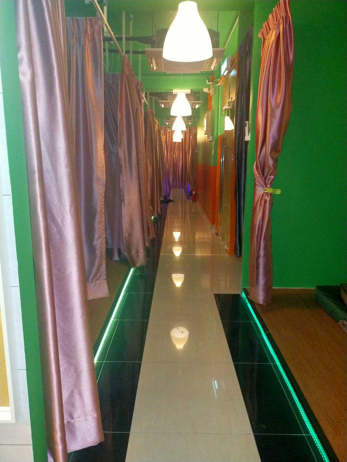 Curtained massage bay corridor at Sabai 99