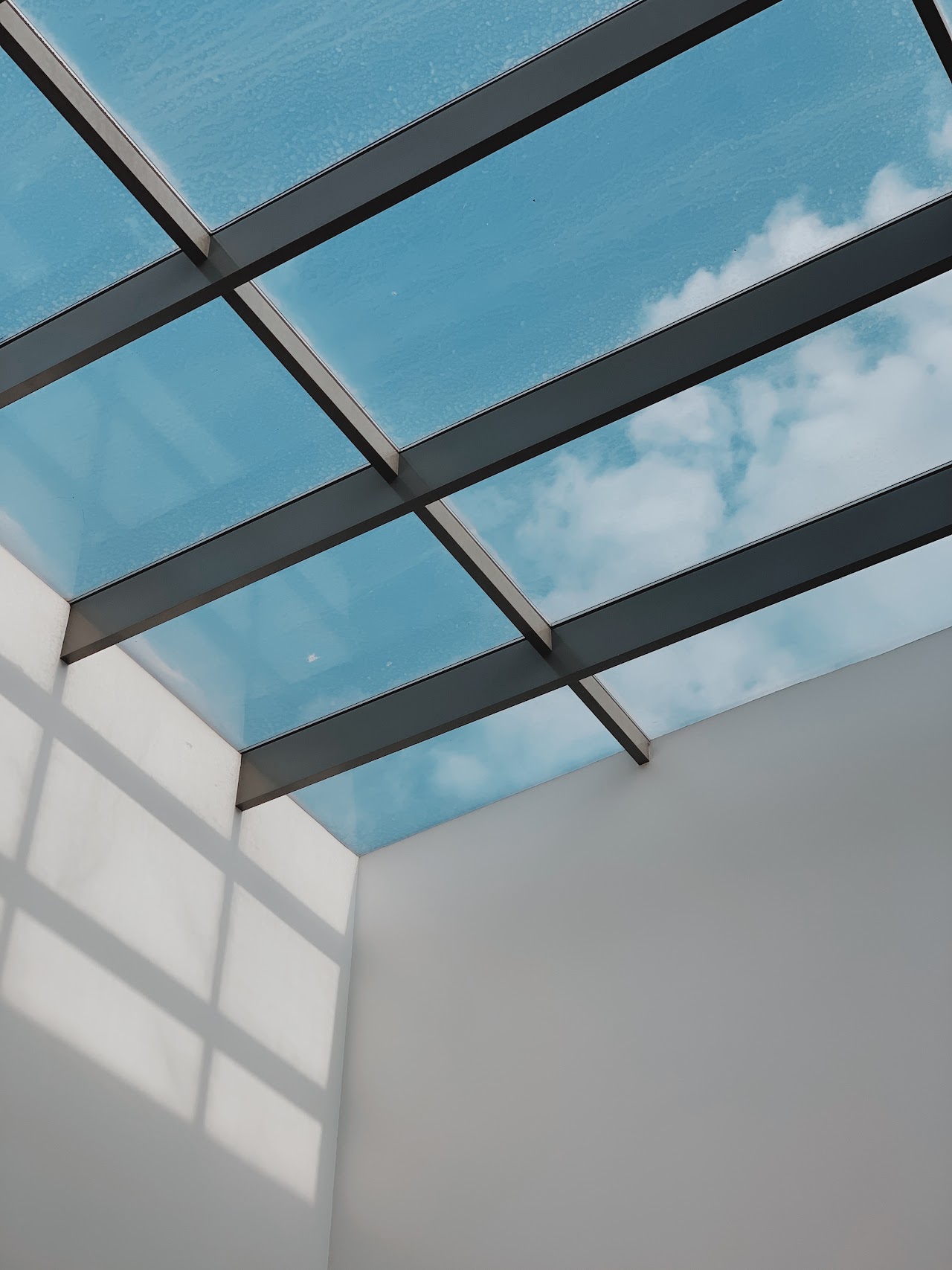 Glass skylight roof against open sky