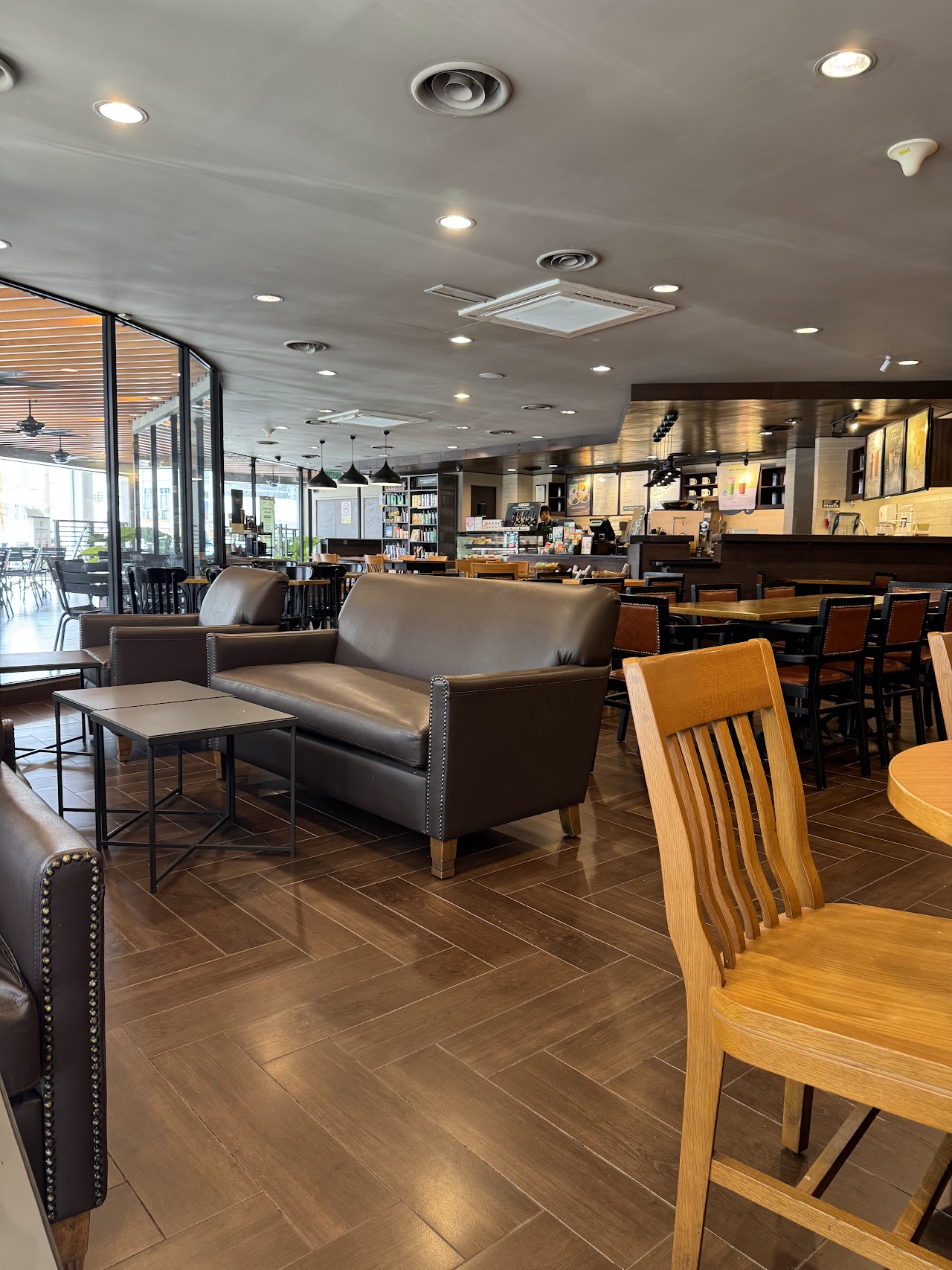 Lounge seating with herringbone wood floor at Starbucks USJ Taipan