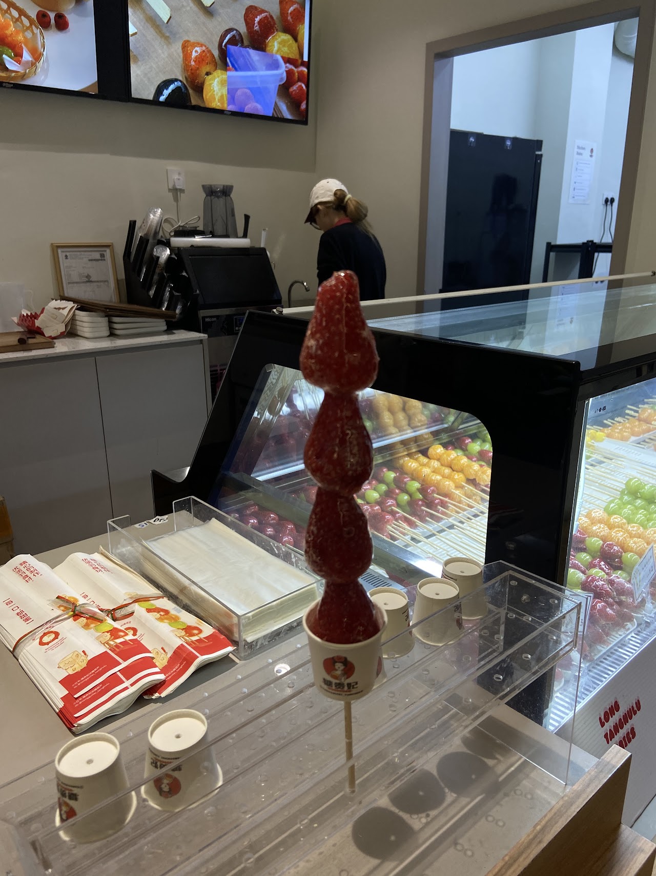 Single strawberry tanghulu skewer close up