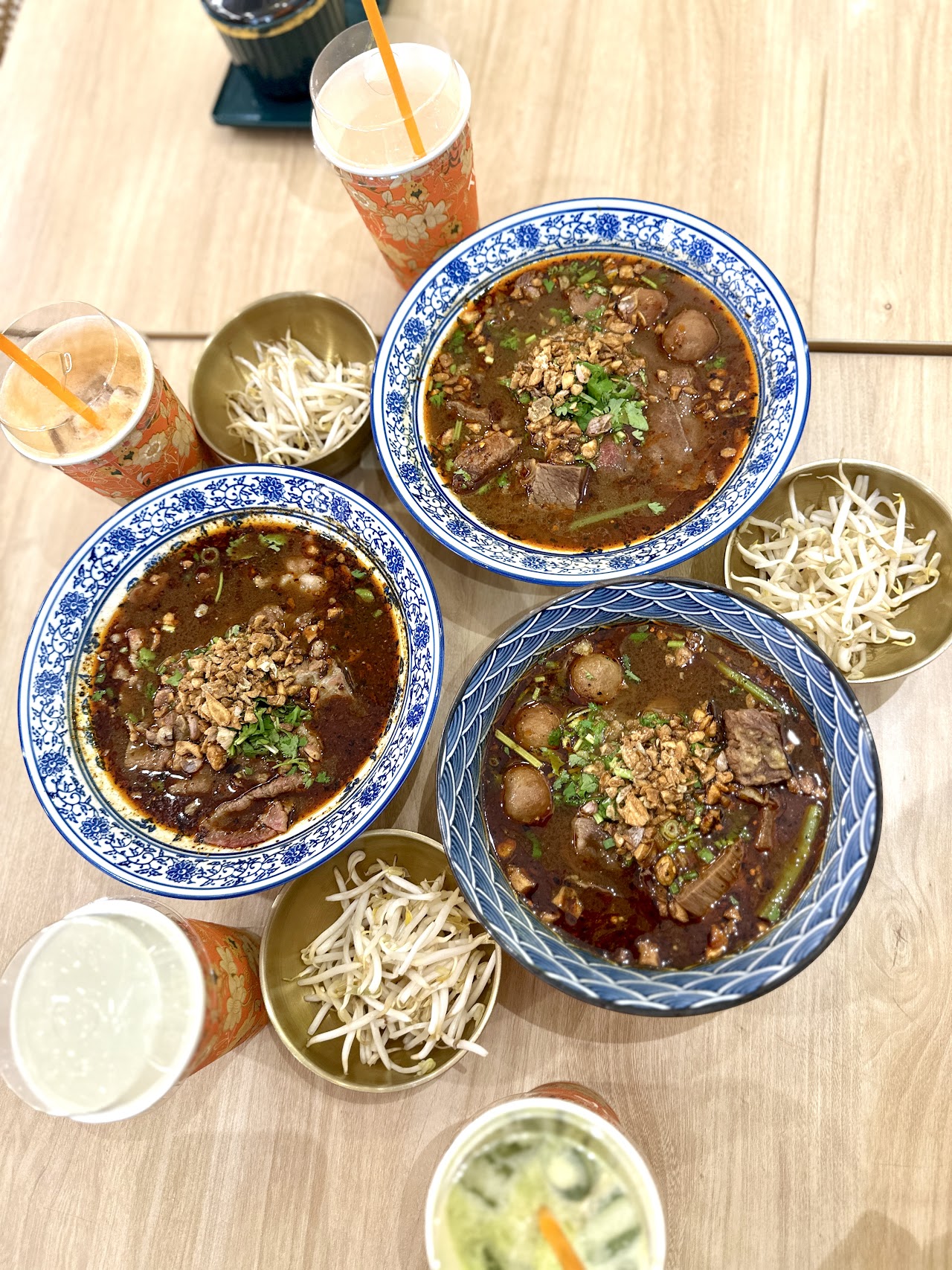 Three bowls of beef noodle soup at Thong Bowl